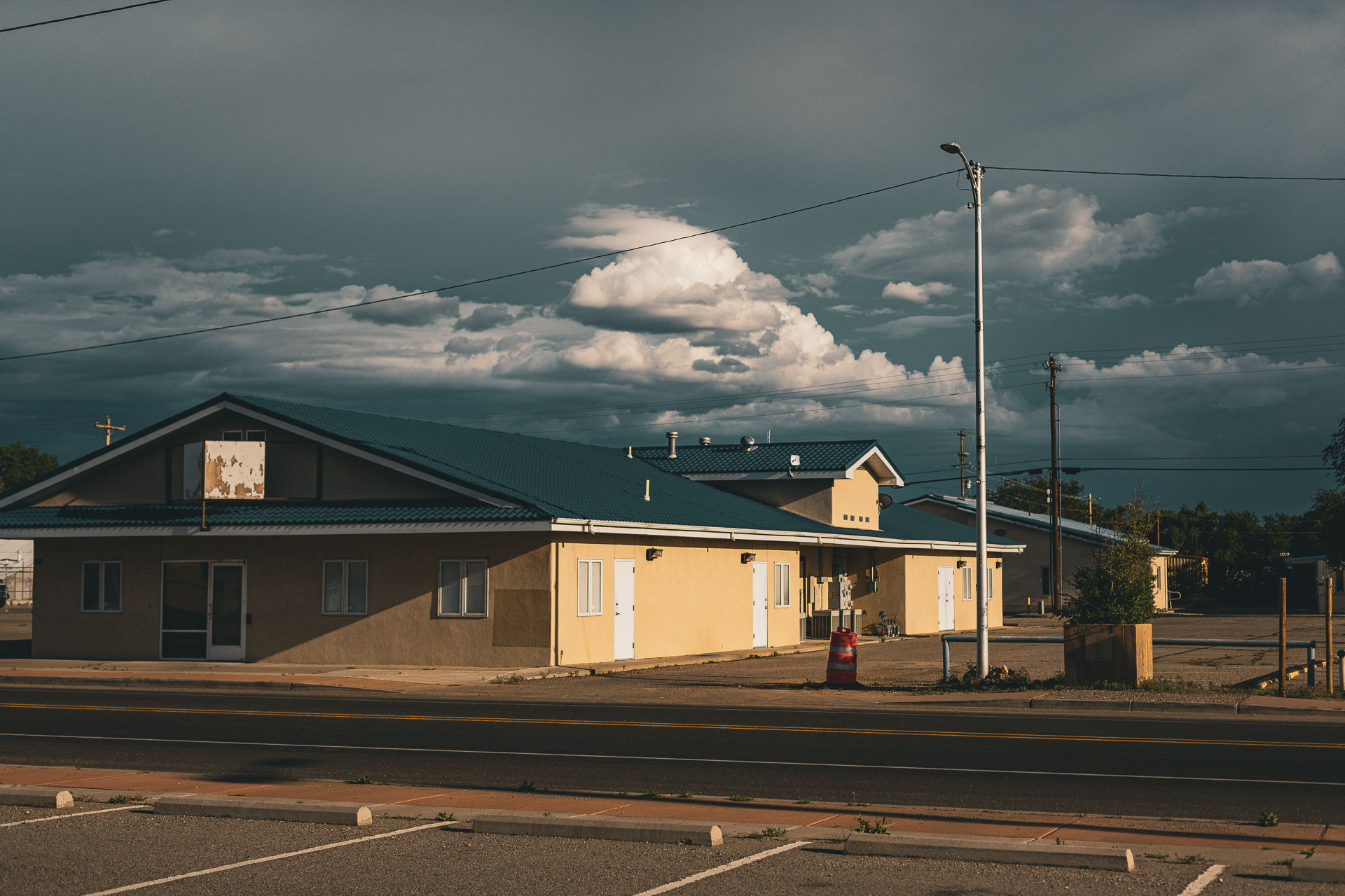 commercial building in an empty parking lot.