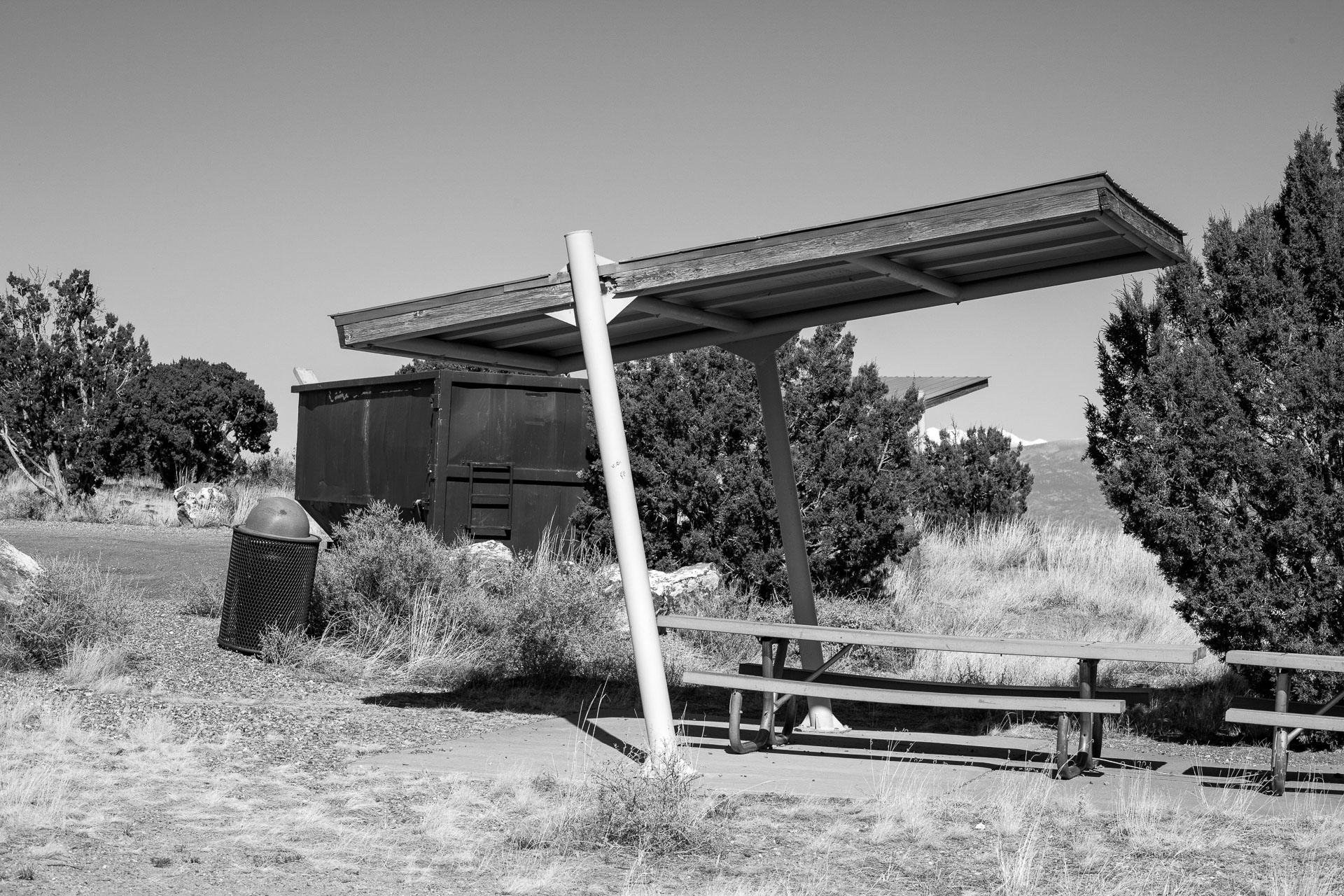 picnic table under small shade canopy.