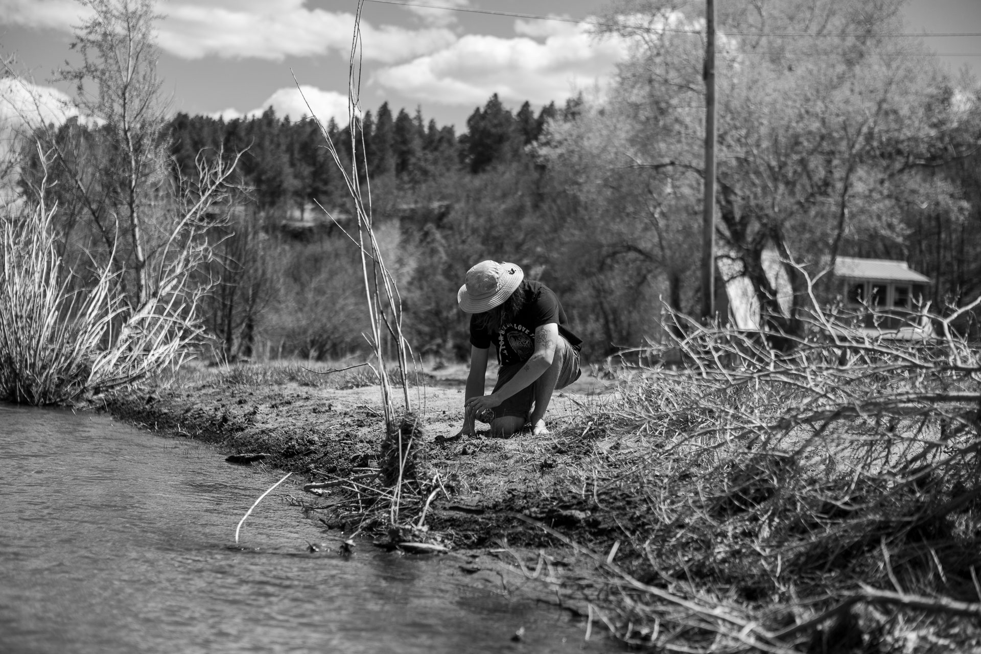 man exploring river.