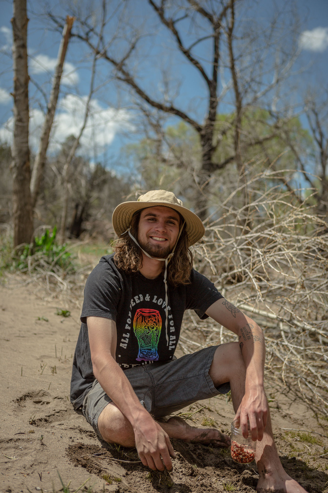 man sitting in dirt.